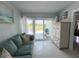 Cozy living area with comfortable seating and view to the outdoor patio and grill at 2500 Aquilos Ct, Port Charlotte, FL 33952