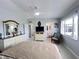 Bright main bedroom with ensuite bathroom, tv, and a comfortable sitting area at 2500 Aquilos Ct, Port Charlotte, FL 33952