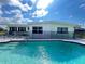 Enjoy the sunshine by the backyard pool of this single story home at 2500 Aquilos Ct, Port Charlotte, FL 33952