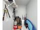 A small storage area featuring a variety of tools and cleaning supplies at 2500 Aquilos Ct, Port Charlotte, FL 33952