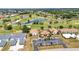An aerial view of condos, a golf course, and lakes surrounded by trees at 26336 Nadir Rd # 10, Punta Gorda, FL 33983