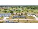 An aerial view of a well-maintained condo community with lush landscaping, parking, and a golf course at 26336 Nadir Rd # 10, Punta Gorda, FL 33983