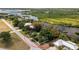 Beautiful aerial view of a waterfront property with lush greenery and direct access to the river at 31037 Prairie Creek Dr, Punta Gorda, FL 33982