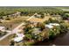 Wonderful aerial view of a property nestled among trees near a body of water in a quiet neighborhood at 31037 Prairie Creek Dr, Punta Gorda, FL 33982