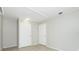 A view of the bedroom showing the closet doors and electrical sockets at 31037 Prairie Creek Dr, Punta Gorda, FL 33982