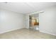 A view of the bedroom with tile flooring and sliding door to the back at 31037 Prairie Creek Dr, Punta Gorda, FL 33982