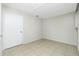 Bedroom with tile floors, neutral walls, and bright light at 31037 Prairie Creek Dr, Punta Gorda, FL 33982