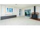Spacious living area with modern built-ins, fireplace, and access to outdoor views at 31037 Prairie Creek Dr, Punta Gorda, FL 33982