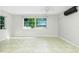 Bright living room with tile floors, ceiling fan, and plenty of natural light at 31037 Prairie Creek Dr, Punta Gorda, FL 33982