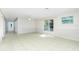 Bright living room featuring tile flooring, large window, and neutral paint palette at 31037 Prairie Creek Dr, Punta Gorda, FL 33982
