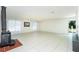 Bright and airy living room featuring a fireplace, tile floors, and abundant natural light at 31037 Prairie Creek Dr, Punta Gorda, FL 33982