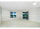A view of the living room with bright light, and a window overlooking the water at 31037 Prairie Creek Dr, Punta Gorda, FL 33982