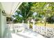 Outdoor patio with an open table and shade from the sun with a great scenic garden at 31037 Prairie Creek Dr, Punta Gorda, FL 33982