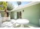 Outdoor patio with an open table and shade from the sun for a great outdoor seating area at 31037 Prairie Creek Dr, Punta Gorda, FL 33982