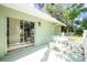 Outdoor patio with an open table and shade from the sun for a great place for outdoor seating at 31037 Prairie Creek Dr, Punta Gorda, FL 33982