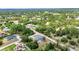 Aerial view showcases a serene residential area with lush greenery, and well-spaced houses at 3104 Garbett Ter, North Port, FL 34288