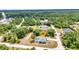 Aerial view of the property with a private swimming pool and a sprawling green landscape at 3104 Garbett Ter, North Port, FL 34288