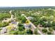 Aerial shot of a single-Gathering home in a lush, green neighborhood at 3104 Garbett Ter, North Port, FL 34288