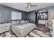 Bedroom with ensuite bathroom and closet, stylish ceiling fan and modern plank flooring at 3104 Garbett Ter, North Port, FL 34288