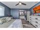 Bedroom with ensuite bathroom and closet, stylish ceiling fan and modern plank flooring at 3104 Garbett Ter, North Port, FL 34288