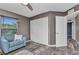 Bedroom featuring light blue accent wall, and an adjacent hallway and large closet at 3104 Garbett Ter, North Port, FL 34288