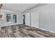 Open-concept living room with modern flooring, natural light, and easy access to the outdoor pool area at 3104 Garbett Ter, North Port, FL 34288