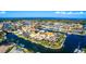 Aerial view of a stunning waterfront property with deep water access, showcasing luxurious coastal living at its finest at 3520 Caya Largo Ct, Punta Gorda, FL 33950