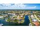 Beautiful aerial view of waterfront homes with private boat docks along canals on a sunny day at 3520 Caya Largo Ct, Punta Gorda, FL 33950