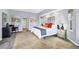 Primary bedroom featuring tile floors, modern furniture, and recessed lighting at 3520 Caya Largo Ct, Punta Gorda, FL 33950