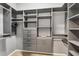 Walk-in closet with built-in shelving, drawers, and ample storage space at 3520 Caya Largo Ct, Punta Gorda, FL 33950