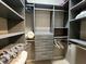 Walk-in closet with custom shelving and drawers, offering ample storage space at 3520 Caya Largo Ct, Punta Gorda, FL 33950