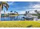 Home with a private dock, boat lift, and waterfront access for boating and water activities at 3520 Caya Largo Ct, Punta Gorda, FL 33950