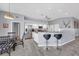 Bright kitchen featuring white cabinetry, stainless steel appliances, granite counters and an adjacent dining area at 3520 Caya Largo Ct, Punta Gorda, FL 33950