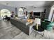 Open-concept living room featuring high ceilings, stylish decor, and tile floors at 3520 Caya Largo Ct, Punta Gorda, FL 33950