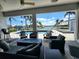Waterfront patio with outdoor seating around a fire pit with a view of the tropical waterway at 3520 Caya Largo Ct, Punta Gorda, FL 33950