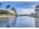 Picturesque waterfront view showcases the calm canal waters and neighboring homes in a serene setting at 3520 Caya Largo Ct, Punta Gorda, FL 33950
