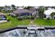 Aerial view of a property featuring a pool, screened lanai, and private boat dock at 3787 Whippoorwill Ct, Punta Gorda, FL 33950