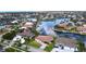 Aerial view of canal-front homes in a waterfront community at 3787 Whippoorwill Ct, Punta Gorda, FL 33950
