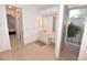 Elegant bathroom with vanity, garden shower, and access to bedroom or dressing area at 3787 Whippoorwill Ct, Punta Gorda, FL 33950