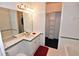 Bathroom featuring vanity, mirror, and a shower/tub combo at 3787 Whippoorwill Ct, Punta Gorda, FL 33950