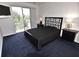 Bedroom features a sliding glass door, a ceiling fan, and ample natural light at 3787 Whippoorwill Ct, Punta Gorda, FL 33950