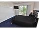 Bedroom featuring a ceiling fan, sliding glass doors to a balcony, and carpeting at 3787 Whippoorwill Ct, Punta Gorda, FL 33950