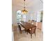 Formal dining room featuring marble floors, recessed shelving, and elegant lighting at 3787 Whippoorwill Ct, Punta Gorda, FL 33950