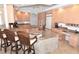 Open kitchen with an island, breakfast bar, and stainless-steel appliances at 3787 Whippoorwill Ct, Punta Gorda, FL 33950