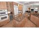 Well-lit kitchen featuring granite countertops, an island, wine cooler, and modern appliances at 3787 Whippoorwill Ct, Punta Gorda, FL 33950