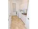 Bright laundry room complete with utility sink and storage at 3787 Whippoorwill Ct, Punta Gorda, FL 33950