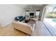 Bright living room with view of the pool through sliding glass doors at 3787 Whippoorwill Ct, Punta Gorda, FL 33950