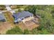 Aerial view of the property featuring the home, fenced backyard and shed at 4129 Palisades Ave, North Port, FL 34287