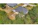 Aerial view of home showcasing the screened-in lanai, patio, and fenced yard at 4129 Palisades Ave, North Port, FL 34287
