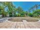 Backyard featuring tiled patio and defined mulch area in the back at 4129 Palisades Ave, North Port, FL 34287